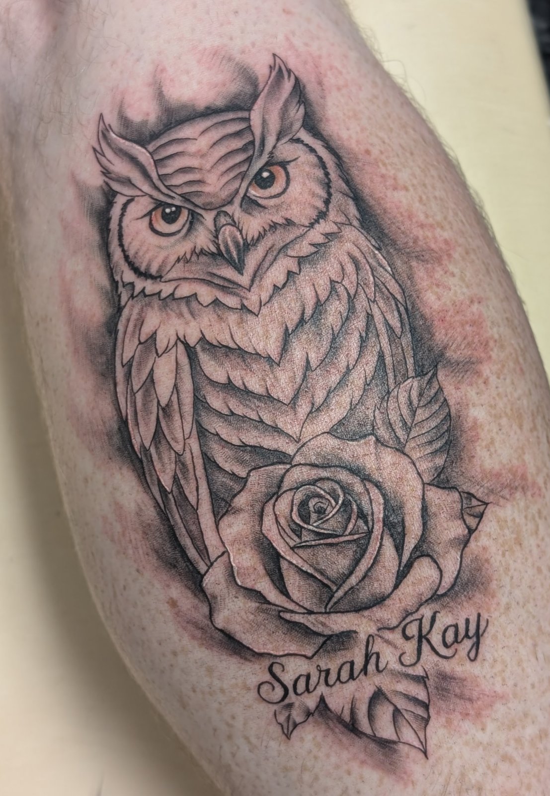 Finished black and grey owl and rose memorial tattoo by Shawn Lowe at Fargo Tattoo in Fargo, North Dakota