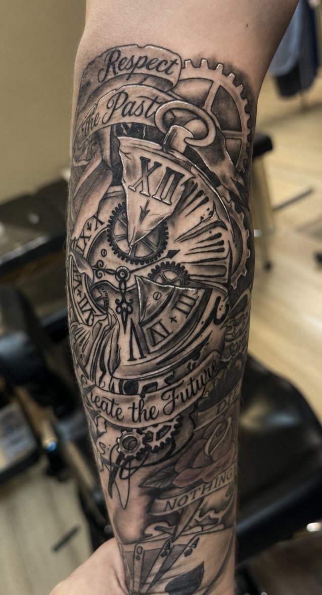 Detailed clockwork tattoo with gears, scissors, and Respect the Past Create the Future lettering by Shawn Lowe at Fargo Tattoo in Fargo, North Dakota