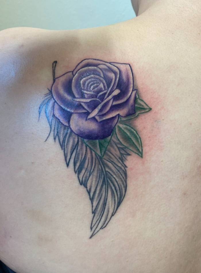 Finished purple rose and feather cover-up completely hiding the old tattoo, Fargo Tattoo